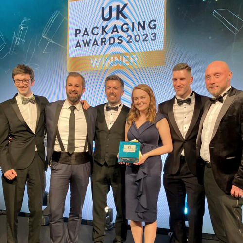 The Cepac team at the UK Packaging Awards 2023. Six members of staff are photographed on stafe.