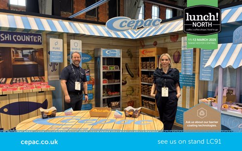 Esther and Nigel at Lunch! North in Manchester on the Cepac stand showing off the Flutepac range. The stand design looks like a retail environment and includes hot and cold cabinets, a sushi counter and a baked goods display. The stand is manufactured out of corrugated card.